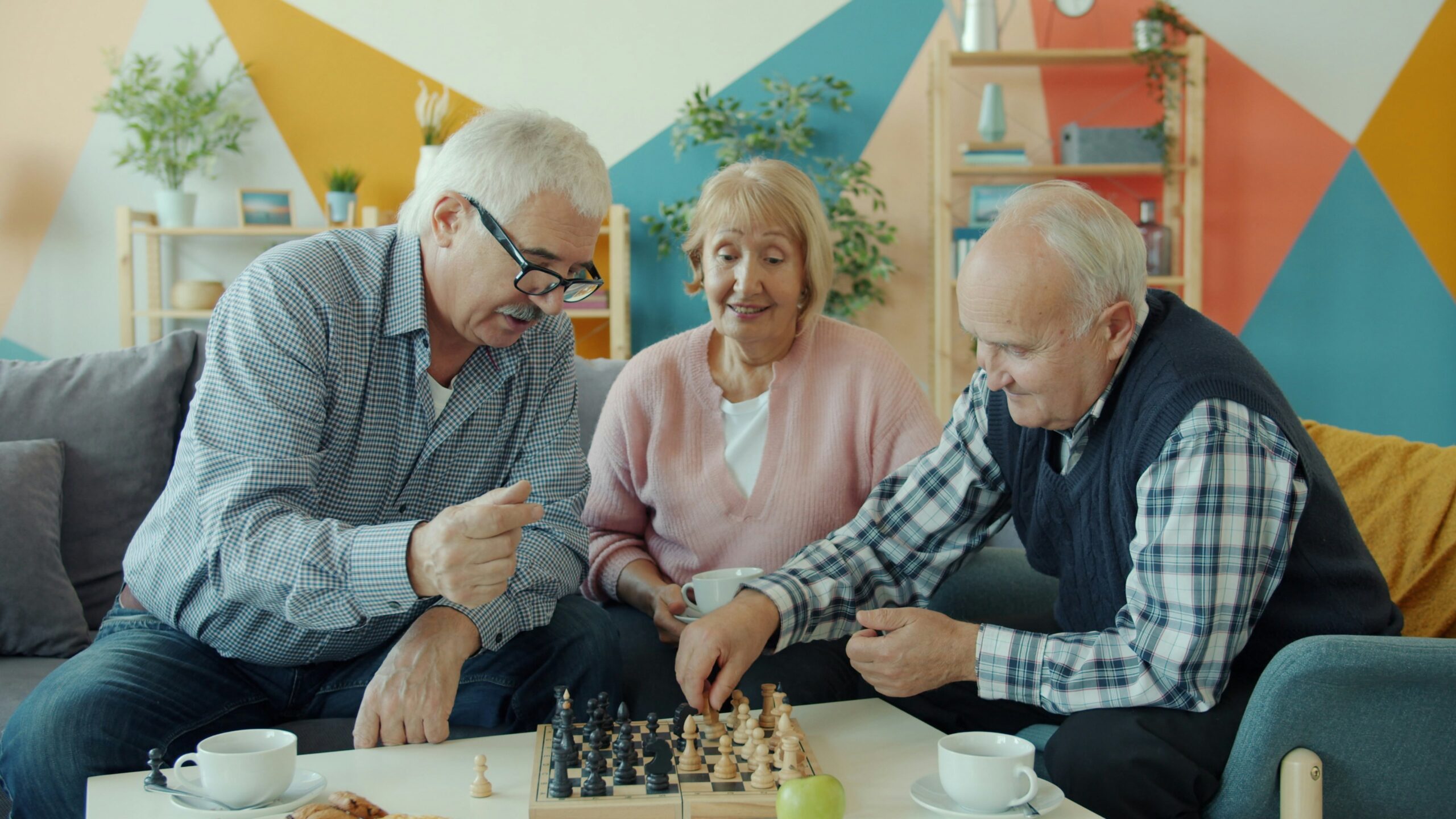 Companion care caregiver laughing with elderly client at home
